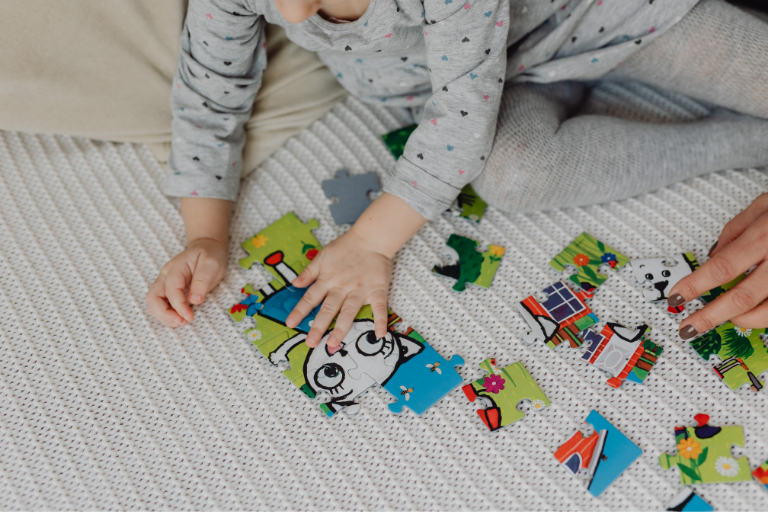 kid playing with Cultural & Science Montessori toys